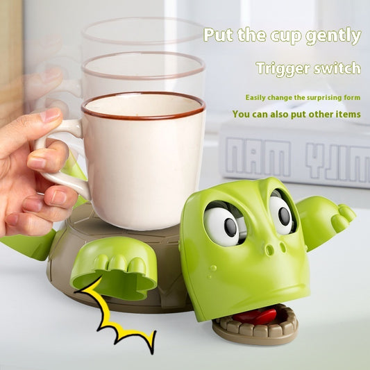 Funny turtle coaster decoration demonstrating interactive design with cup and switch mechanism.